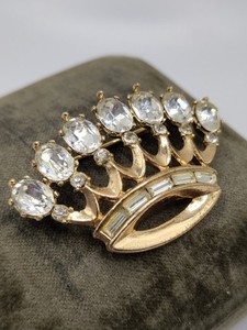 Gold tone crown brooch with rhinestones