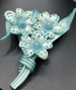 Blue celluloid flower brooch