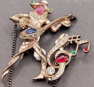 Gold tone dancer jester figure brooch with colored stones
