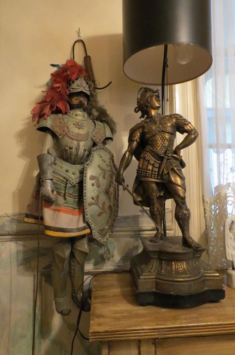 Bronze figural sculptures with a period lamp