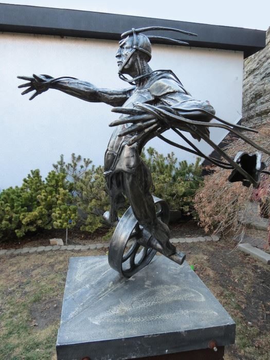 Theodore Gall Stambos steel figure, full view at a West Town estate