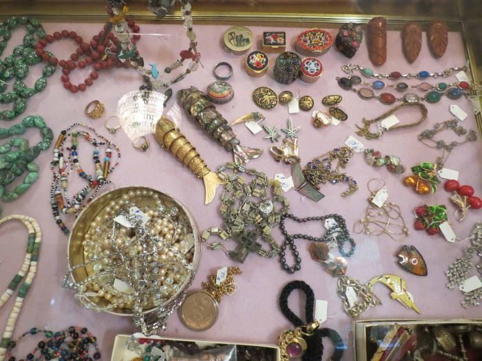 Costume jewelry spread across a table in a Logan Square estate