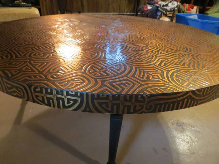 Inlaid round table with geometric pattern