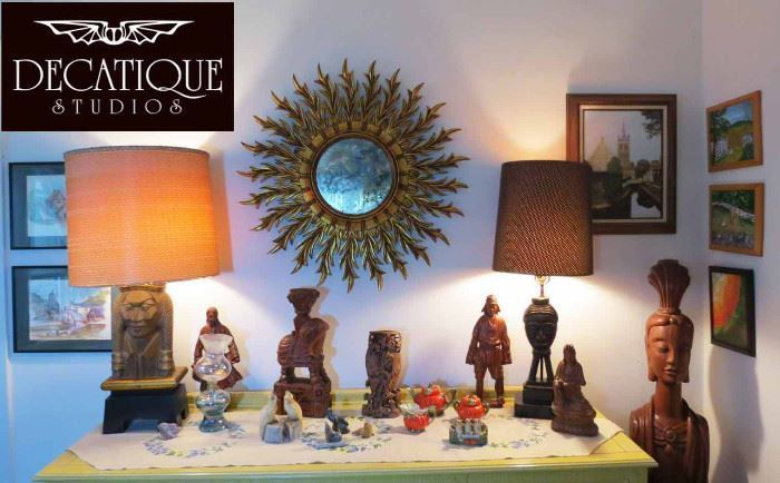 Mid-century starburst mirror and carved Asian figurines at a Decatique-handled estate