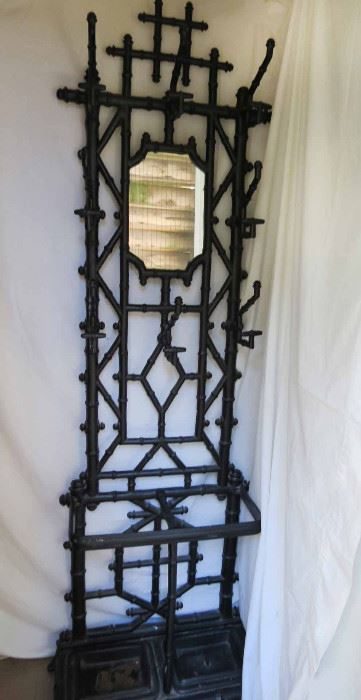 Tall carved ebonized plant stand