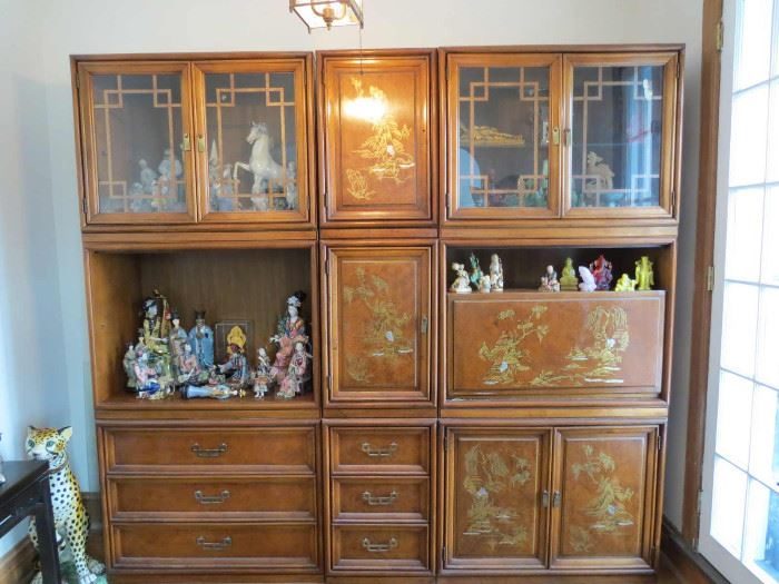 Henry Link wall unit cabinet filled with figurines
