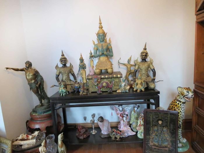 Thai statuary arranged on an altar table in a Lake View estate