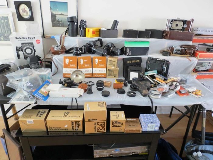 Table of vintage cameras and accessories from a Lincoln Square estate